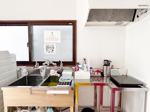 a kitchen with a sink and a counter top at D Hotel - Vacation STAY 89642v in Tokyo