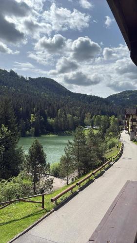 a road with a view of a lake and trees at Apartmán Olívia 8 Hrabovská dolina in Ružomberok