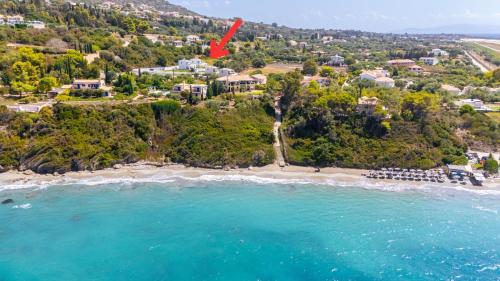 an aerial view of a beach with a red arrow at Villa Nefeli - Elysian Villas Kefalonia, 200m from Beach, New 2024 in Minia