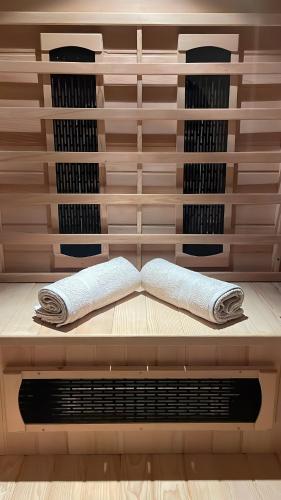 a wine cellar with two towels on a shelf at La Casa Senja in Håverjorda