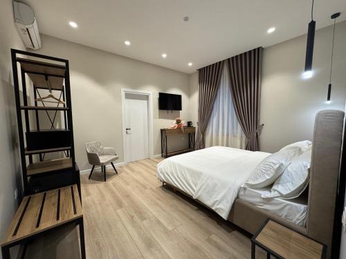 Postel nebo postele na pokoji v ubytování Rooms at Mimosa Street