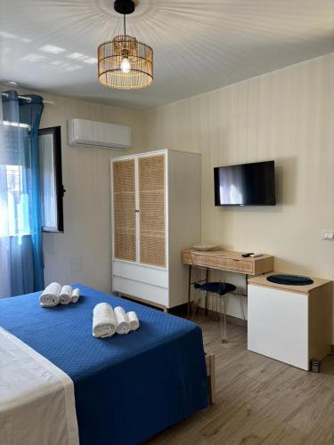 Postel nebo postele na pokoji v ubytování le suite dell'isola