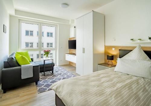 Giường trong phòng chung tại City4Living Boardinghaus Bad Nauheim