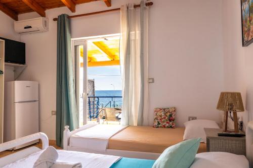 Postel nebo postele na pokoji v ubytování Hotel Portokali