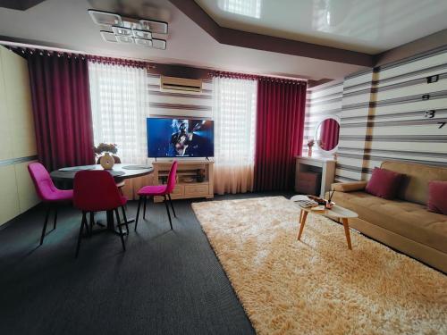 TV a/nebo společenská místnost v ubytování CosHOME - apartament