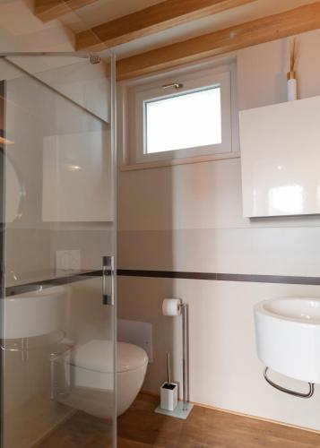 a bathroom with a toilet and a sink at CHARMING MOMENT di Villa Porta - Jolie Maison in Luino