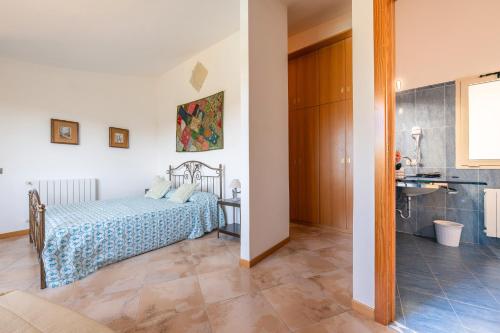 Ένα ή περισσότερα κρεβάτια σε δωμάτιο στο Villa Harmònia