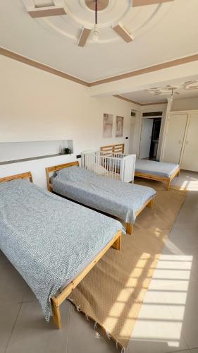 Ένα ή περισσότερα κρεβάτια σε δωμάτιο στο Villa Quilates