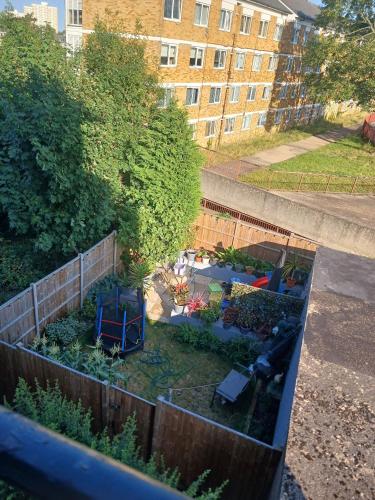 an aerial view of a garden in a backyard at Charming London Guest Room with Garden BBQ in London