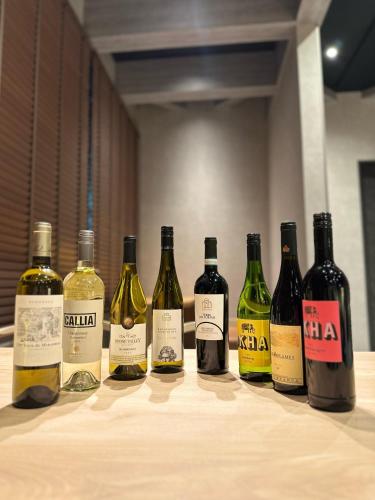 a group of wine bottles sitting on a table at 白水温泉竹の倉山荘 in Minami Aso