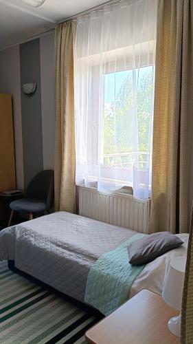 Postel nebo postele na pokoji v ubytování Gościniec Pieniński