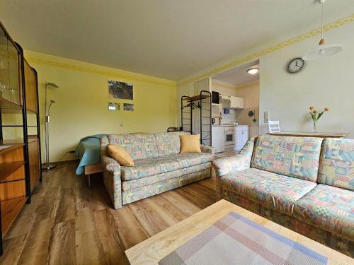 a living room with a couch and a table at Ferienwohnung Köhler Heymann in Dornholzhausen