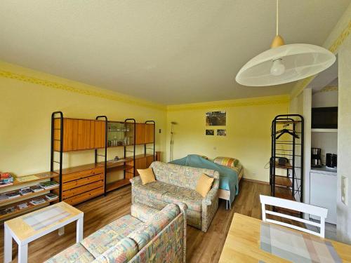 a living room with a couch and bunk beds at Ferienwohnung Köhler Heymann in Dornholzhausen