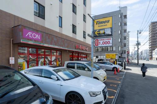 a group of cars parked in front of buildings at Abe101 in Sapporo