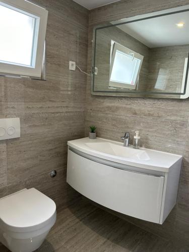 Koupelna v ubytování Apartments Jurić