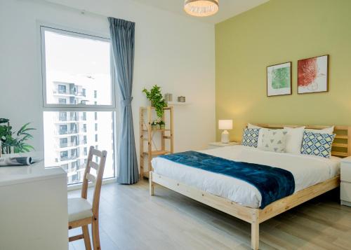 a bedroom with a bed and a large window at Maison Privee - Modern Yas Island Escape with Peaceful Canal Views in Yas Island