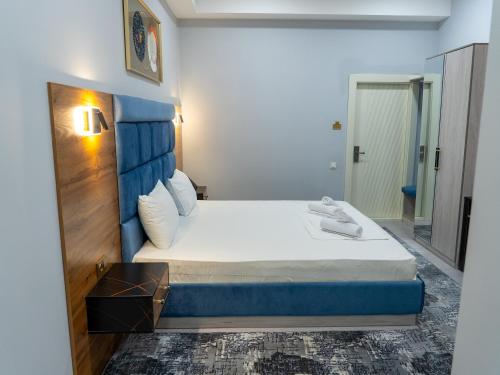Ένα ή περισσότερα κρεβάτια σε δωμάτιο στο Express Tashkent Hotel&Spa