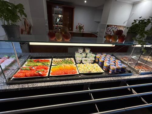 a buffet line with many different types of food at Adalbertus Dom Pielgrzyma in Gniezno