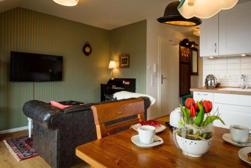 a living room with a table and a couch at Zweitraum in Oldenburg in Oldenburg