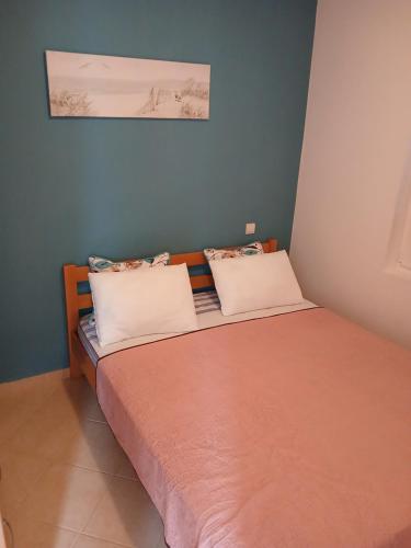 Una cama o camas en una habitación de Apartmani Peace