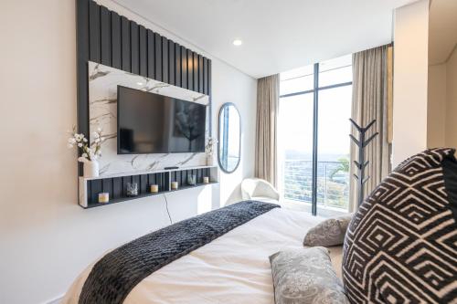 Ένα ή περισσότερα κρεβάτια σε δωμάτιο στο Sandton Skyline Stay