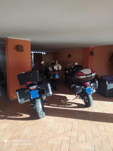 a group of motorcycles parked in a garage at LeonessAffittacamere in Leonessa