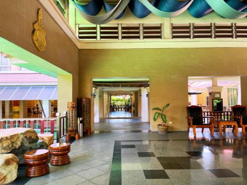 a lobby of a building with chairs and tables at Eastern Grand Palace in Pattaya South