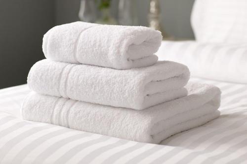 En eller flere senge i et værelse på ASTOS Vila in Palanga