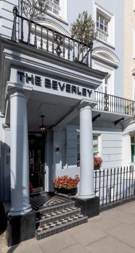 a white building with a sign that reads the beverley at The Beverley Hotel London - Victoria in London