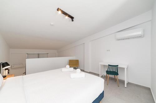 Postel nebo postele na pokoji v ubytování Danai & Palm Residential Complexes