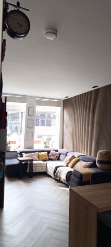 a room with a bunch of beds in it at Comfortable, cozy house 20 min to Amsterdam in Zaandam