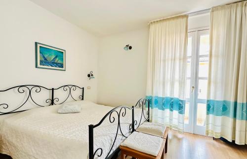 Postel nebo postele na pokoji v ubytování B&B Tre - Rooms & Relax