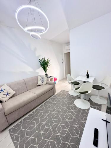 a living room with a couch and a table at Augustus roman emperor in Lido di Jesolo