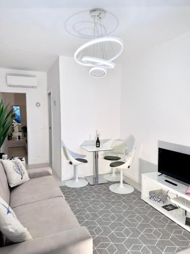 a living room with a couch and a table at Augustus roman emperor in Lido di Jesolo