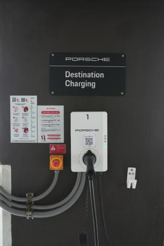 a sign on a wall that says destination charging at VIE Hotel Bangkok - MGallery Collection in Bangkok
