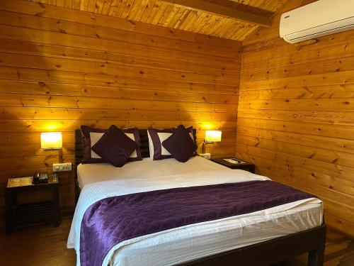 a bedroom with a bed in a wooden wall at Farm Regency in Mumbai