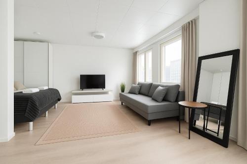 โทรทัศน์และ/หรือระบบความบันเทิงของ City Home Finland - Junior Suite - Great Location and Amenities