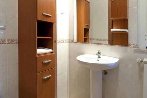 a bathroom with a sink and a mirror at Le Residenze di Santa Costanza - Mirto/Corbezzolo in San Vincenzo