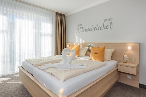 Ένα ή περισσότερα κρεβάτια σε δωμάτιο στο Aparthotel Strandhus