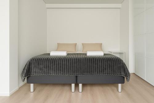 เตียงในห้องที่ City Home Finland - Junior Suite - Great Location and Amenities