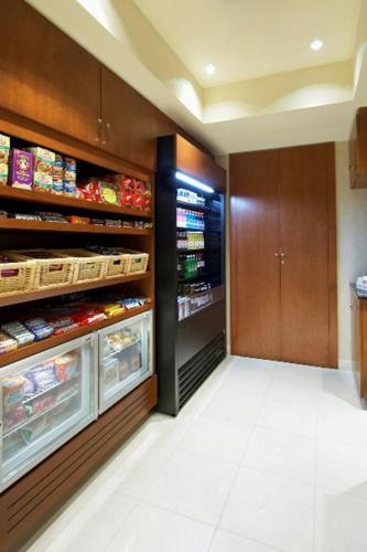 a kitchen with an open refrigerator with food at Residence Inn East Rutherford Meadowlands in East Rutherford