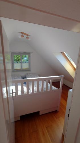 a room with a loft bed and two windows at Bergisch Grün in Wuppertal