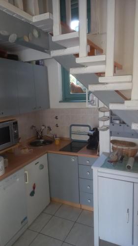 Kuchyň nebo kuchyňský kout v ubytování LUKA- cozy apartment