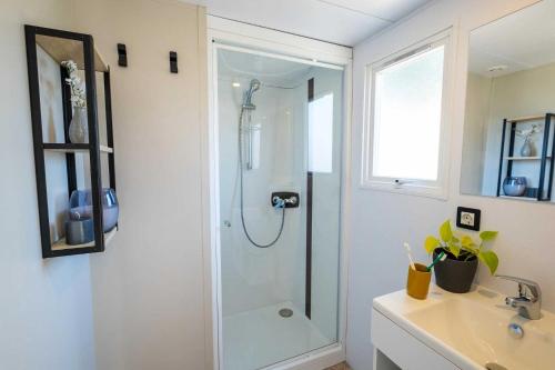 a bathroom with a shower and a sink at Camping 4 étoiles - Parc aquatique - ef0bdc in Martigues