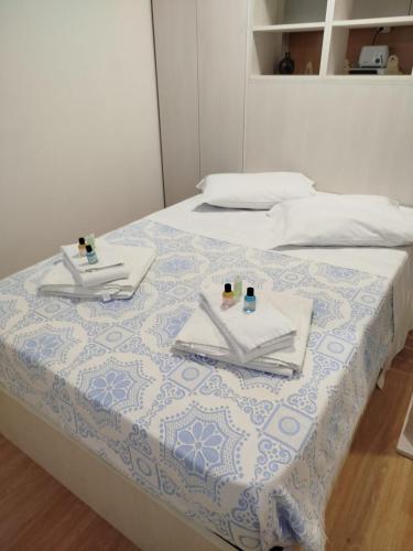 Giường trong phòng chung tại Estúdio Guimarães