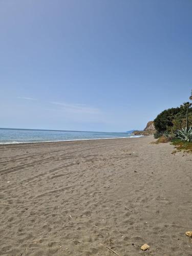 an empty beach with the ocean in the background at Almayate Playa Studio in Almayate Alto