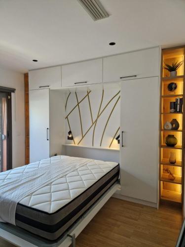 a bedroom with a large bed in a room at Almayate Playa Studio in Almayate Alto
