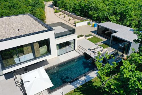 an aerial view of a house with a swimming pool at Luxury Villa Cloer, Jadranovo - Sauna,Steam room, 2 Jacuzzis in Jadranovo