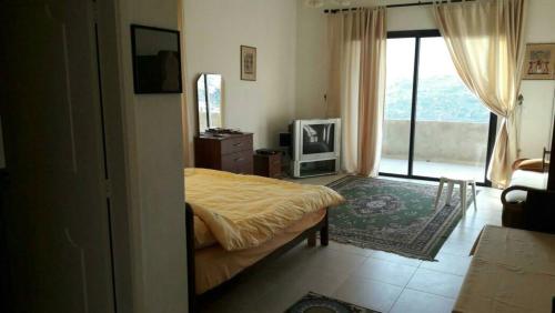 Кровать или кровати в номере Noujoum El Sama