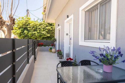 a small balcony with a table and chairs at Natalia's Nest in Ampavris